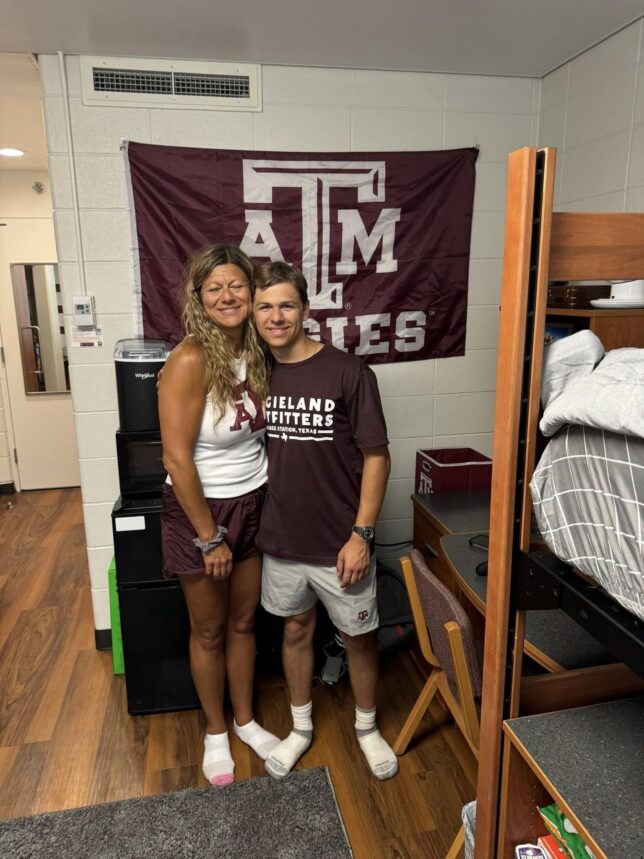 Aggie mom Christina with her son in his Texas A&M dorm room on move-in day.